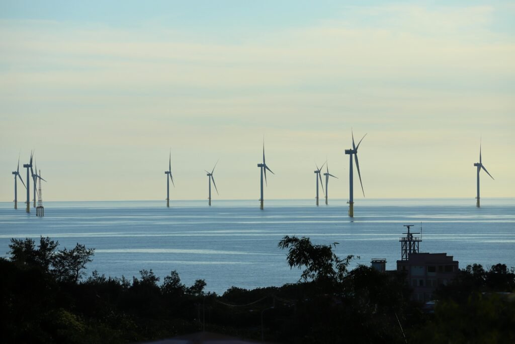 A serene view of offshore wind turbines in Taiwan, showcasing renewable energy at sea.